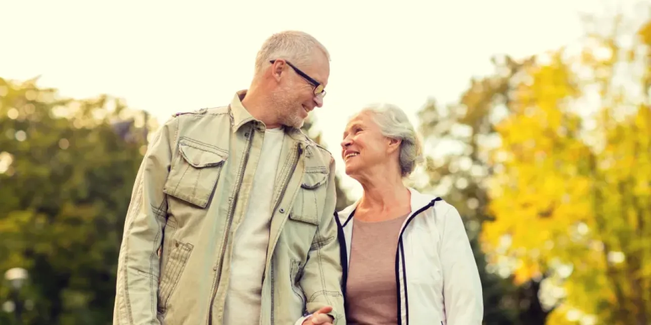 Two older people looking at one another