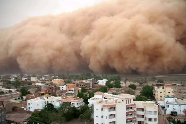 Dust storms over village