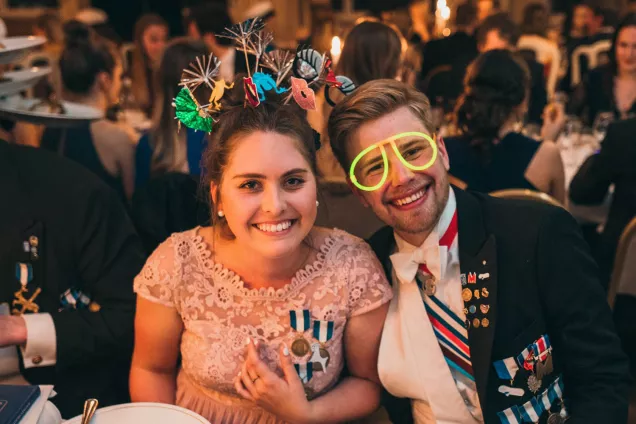 Two dressed-up students at a sittning at one of the nations