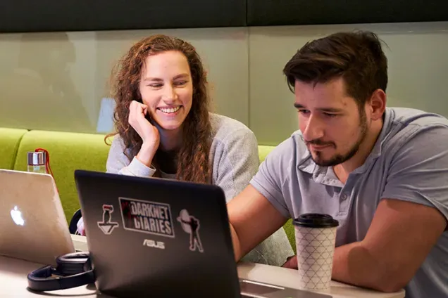 Students with their desktops. Photo.