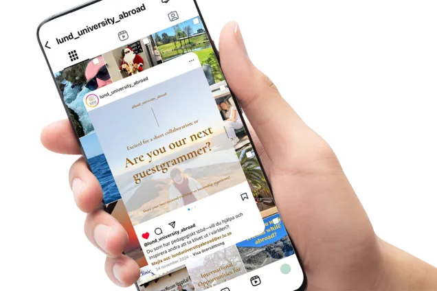 A hand holding a smartphone that displays the @lund_university_abroad Instagram profile on the screen. Photo.