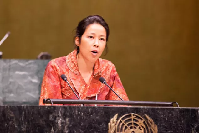 Likki Lee speaking in front of the General Assembly, at the UN headquarters in NYC