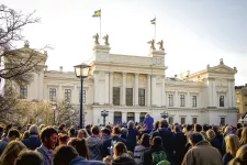 Main university building on May 1st with audience in front