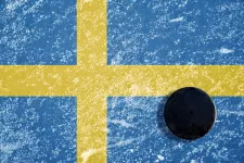 The Swedish flag with an hockey puck. Photo: iStock/vencavolrab 