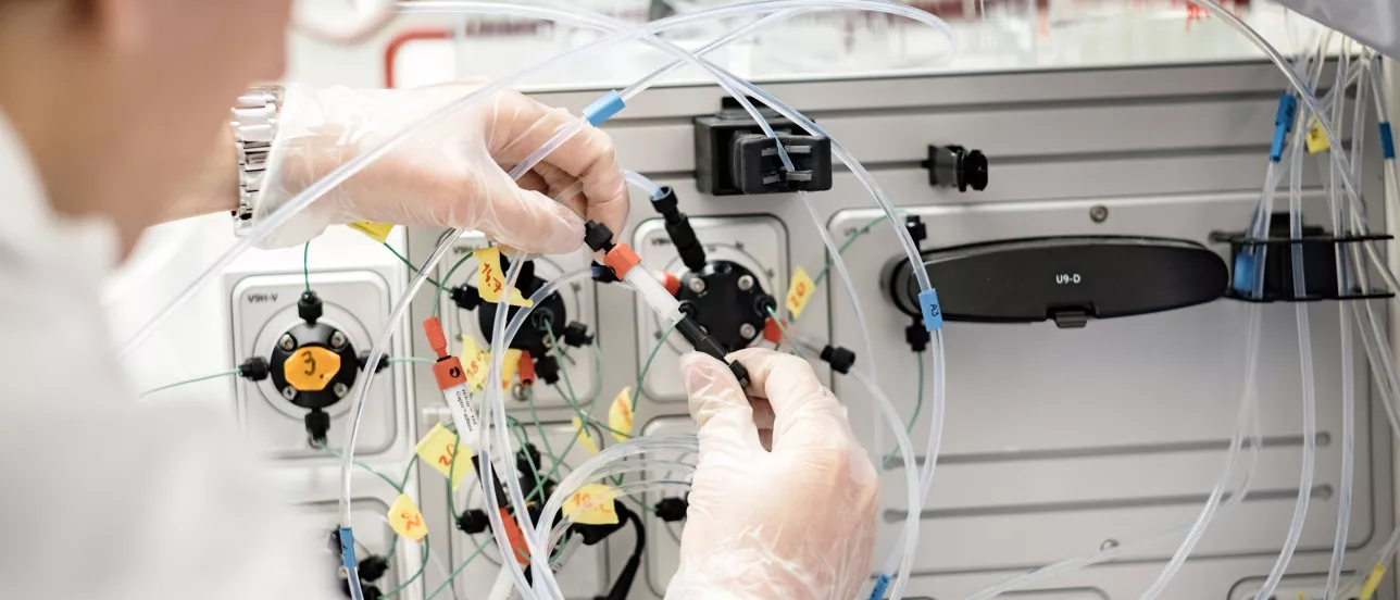 Someone handling biotechnology equipment