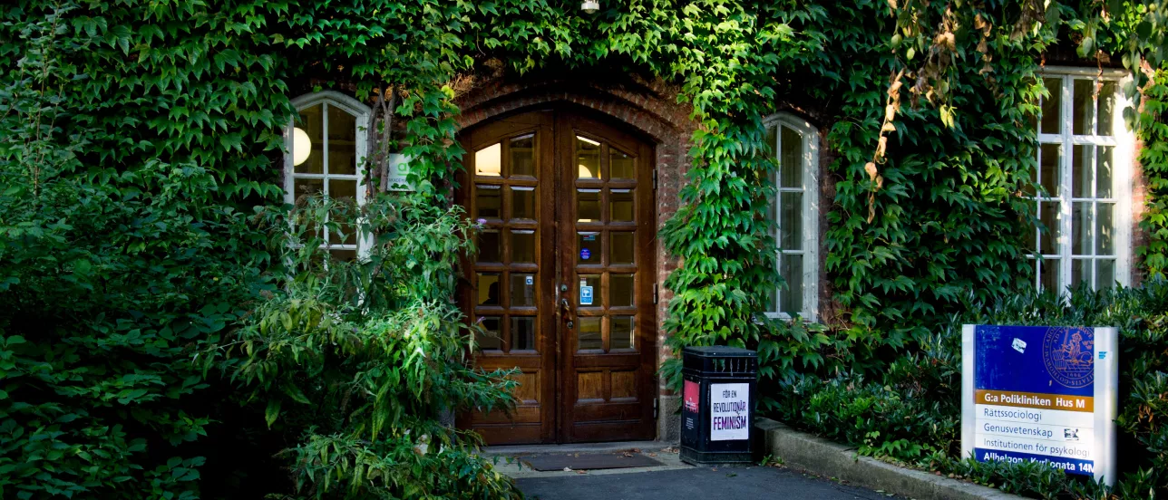 A building covered in green ivy