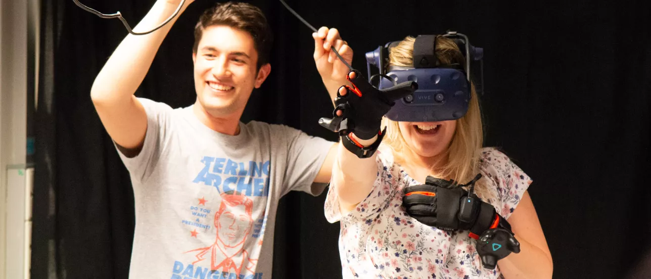 Two students experimenting with virtual reality equipment