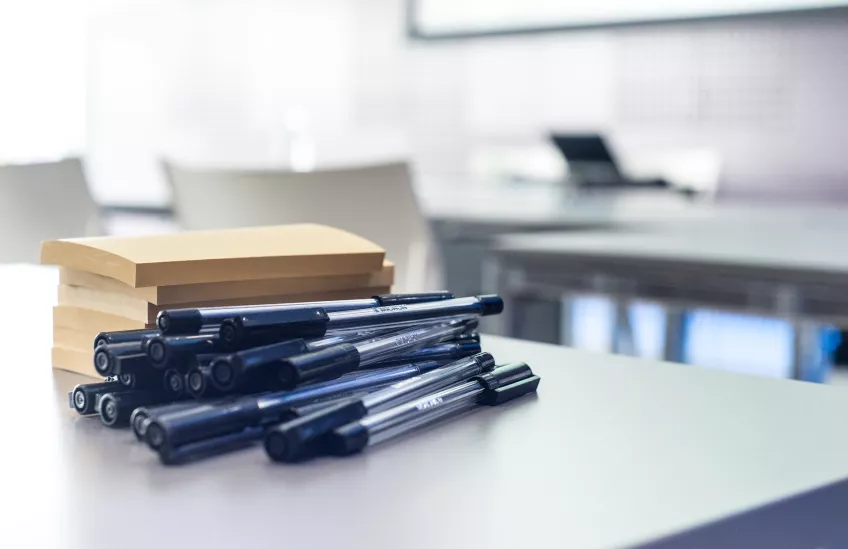 Pens and post-its on a table