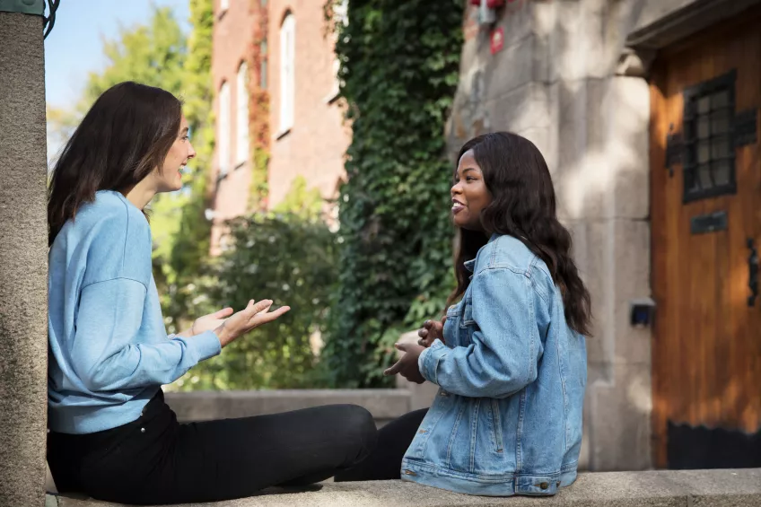 Students talking and gesturing in front of the LUX building. Photo: Johan Bävman.