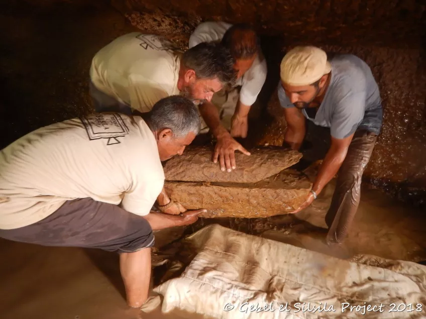 The team prepare one of the child sarcophagi to be lifted
